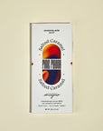 Chocolate bar packaging with 'Salted Caramel' flavor on a beige background