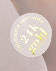 A sticker highlighting the luxury 24K gold leaf used in the kit