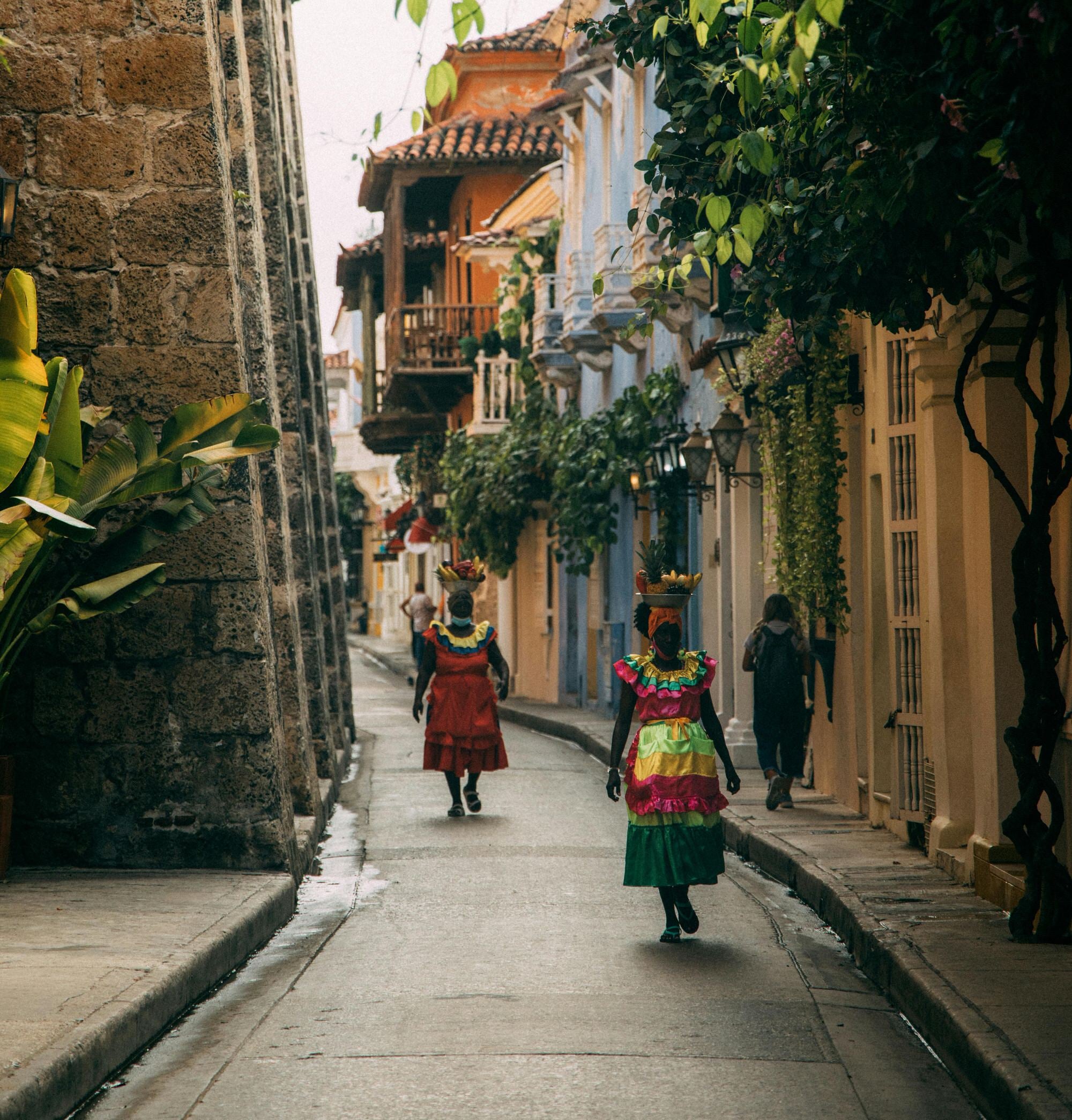 Palenqueras walking the Colonial streets of Colombia one of the many views in our Cartagena Chocolate tour